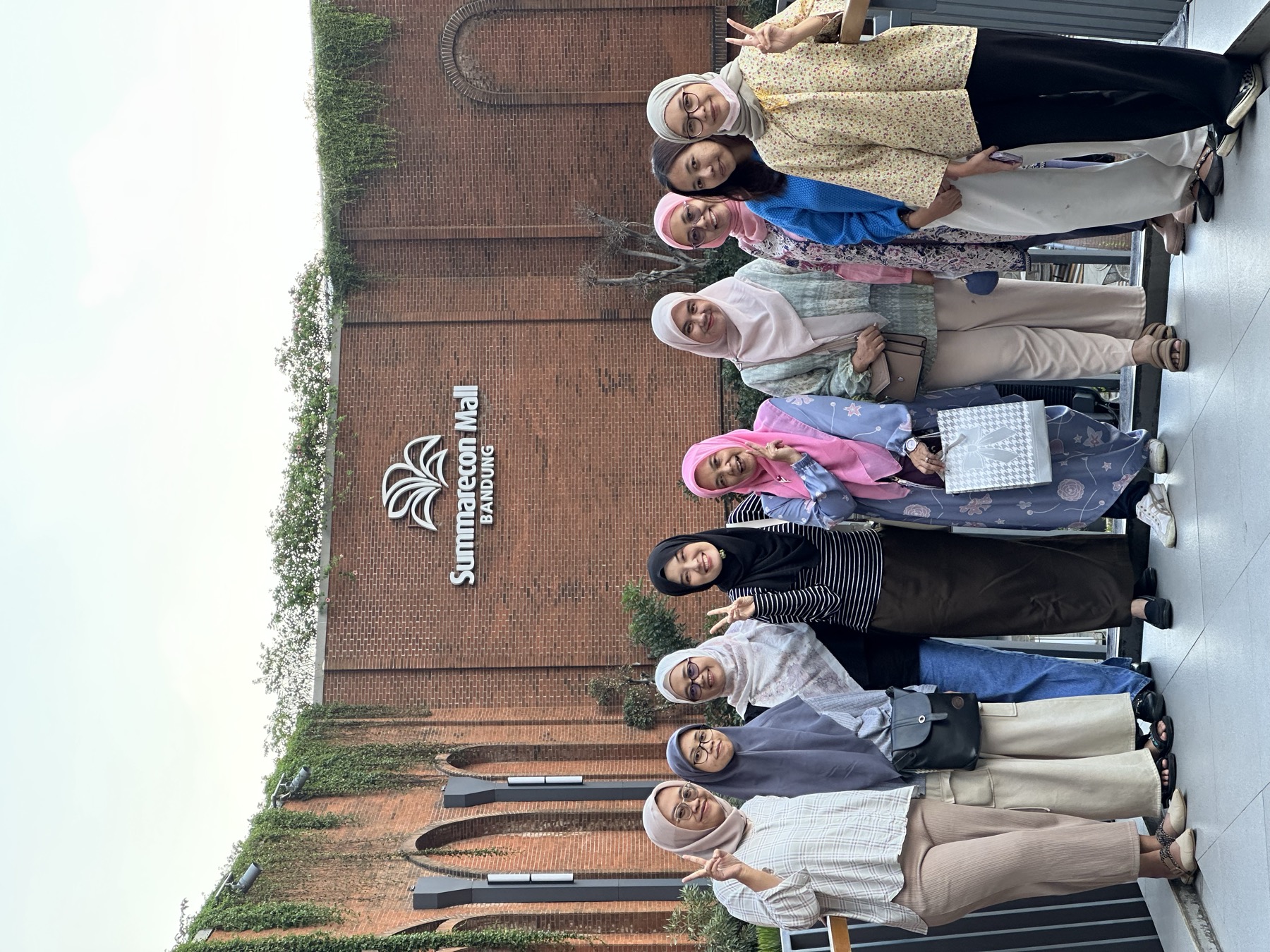 Group members posing together at Summarecon Mall Bandung